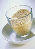 Uncooked fragrant rice in a glass