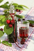 Cherry syrup in bottle and glass