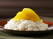 Coconut rice pudding with mango