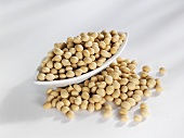 Soya beans in and in front of a bowl