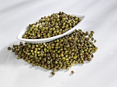Mung beans in and beside a bowl