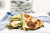 Quesadillas (filled tortillas) with cheese and rocket