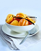 Poached peaches and vanilla pods