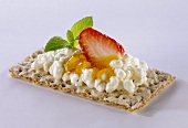 Crispbread topped with cottage cheese and strawberry