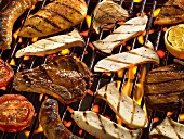 Meat, vegetables and mushrooms on a barbecue
