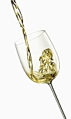 Pouring white wine into a glass