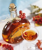 Rowanberry liqueur in bottle and glass
