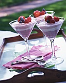 Three glasses of raspberry cream on a tray
