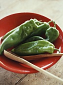 Green pointed peppers on a plate