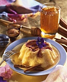 Rice pudding with plums, cinnamon and honey sauce