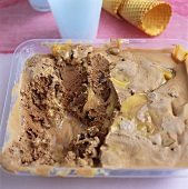 Chocolate and caramel ice cream in a container