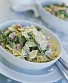 Farfalle with green asparagus, ham and cheese sauce