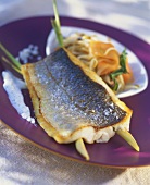 Fried sea bass fillet with lemon grass and vegetables
