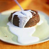 Warm chocolate pudding with vanilla sauce