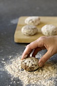 Coating meat patties in wholemeal flour