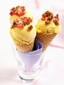 Three vanilla ice creams in waffle cones