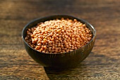 Red lentils in a small bowl