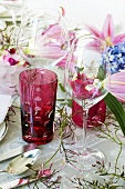 Glasses on festive table with floral decorations