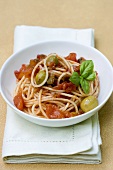 Spaghetti with tomato sauce and green olives