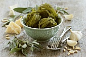 Bowl of spinach pasta with sage, Parmesan and garlic