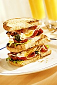 Two club sandwiches in a pile