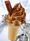 Cone of soft chocolate ice cream with a chocolate flake