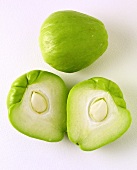 Whole and halved chayote