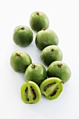 Baby kiwi fruits, one halved