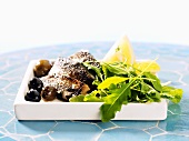 Salted herring with rocket and olives