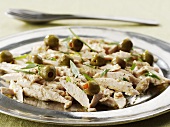 Marinated chicken breast with green olives
