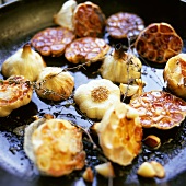 Fried garlic in frying pan