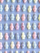 Jelly babies on pale blue background