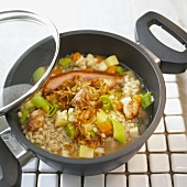 Pearl barley and vegetable stew with belly pork