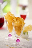 Two glasses filled with Parmesan crisps