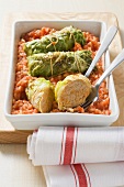 Pointed cabbage roulade on a bed of tomato rice