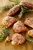 Crostini salsiccia e Stracchino (toasted bread with raw sausage meat and cheese)