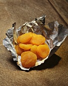 Dried apricots on a piece of paper
