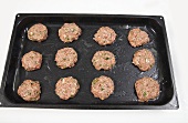 Unfried burgers on a baking tray