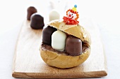 A bread roll filled with chocolate marshmallows