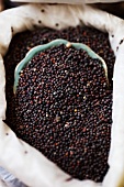 Peppercorns in a sack at a market