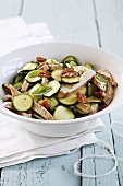 Courgette salad with chicken, nuts and mint