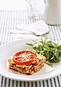 Lasagne with tomatoes and a mixed leaf salad