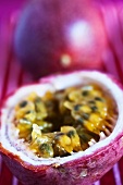 A whole and a halved passion fruit