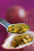 A spoonful of passion fruit flesh