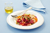 Red cabbage salad with apples, carrots and sunflower and pumpkin seeds