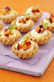 Tartlets with whipped cream and plums