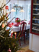 A dining table decorated for Christmas