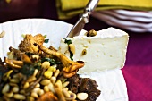 Mushrooms with pine nuts and cheese