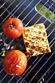 Cheese and tomatoes on a barbeque