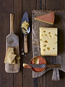 Five different types of cheese on wooden boards